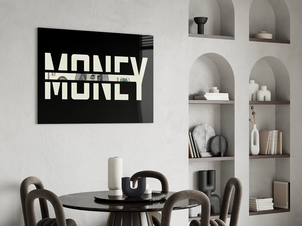 money typography with a hundred dollar bill glass wall art leaning beside a dark leather sofa