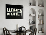 money typography with a hundred dollar bill glass wall art leaning beside a dark leather sofa