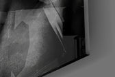 Close-up detail of the black censor bar and marcel-waved curls on the glass surface