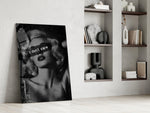 vintage blonde bombshell portrait panel resting in a shelving niche in a modern interior