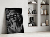 vintage blonde bombshell portrait panel resting in a shelving niche in a modern interior