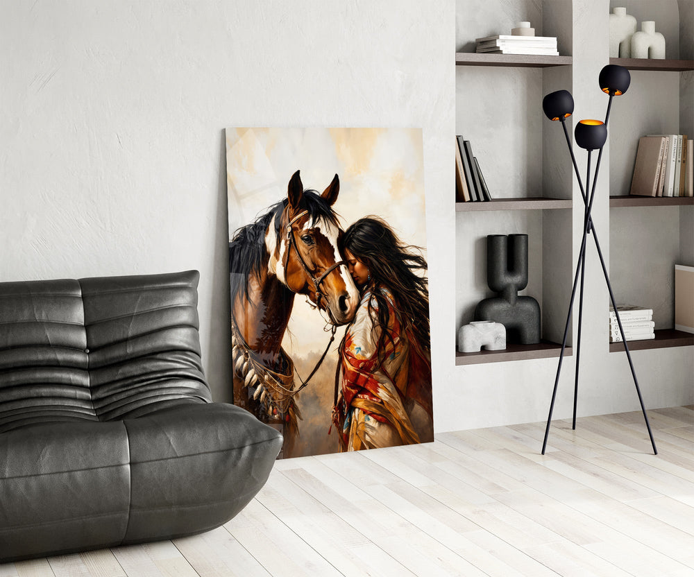 a native woman resting against her horse glass wall art leaning beside a dark leather sofa