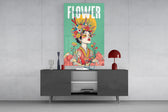 a woman crowned with wildflowers glass wall art styled in an atmospheric room setting