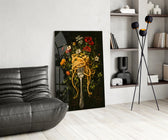 pasta twirled on a fork with blooms glass wall art leaning beside a dark leather sofa