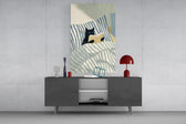 black cat reading in striped bedding glass wall art styled in an atmospheric room setting