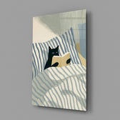 black cat reading in striped bedding glass wall art angled to show the polished tempered glass panel