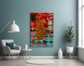 spotted leopard in a bold interior glass wall art styled above an armchair in a reading corner