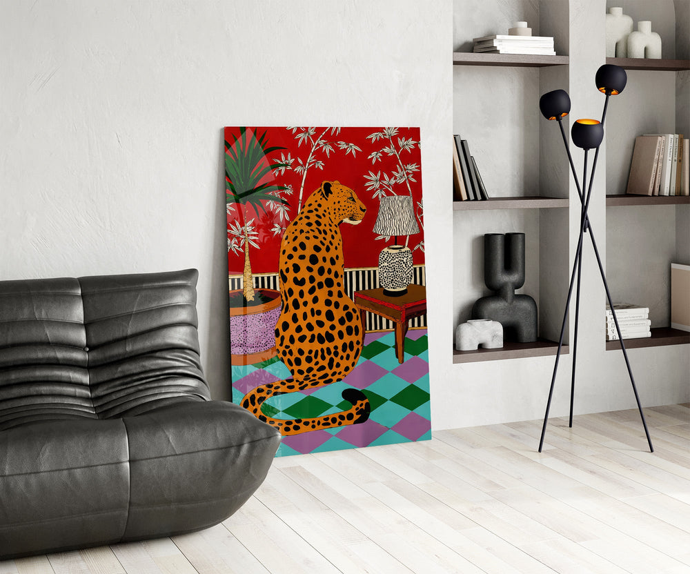 spotted leopard in a bold interior glass wall art leaning beside a dark leather sofa