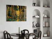 golden forest path through patterned trunks glass wall art leaning beside a dark leather sofa