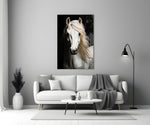 white horse portrait on black panel bringing character to a minimalist living room wall