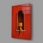 figure reading in a red arched niche glass wall art angled to show the polished tempered glass panel