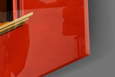 Close-up detail of the open orange book hiding the face and the bare legs on the sill on the glass surface
