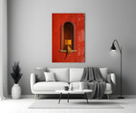 figure reading in a red arched niche panel bringing character to a minimalist living room wall
