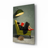 Woman Reading Red Book Green Armchair Glass Wall Art - Lifestyle preview in a designer interior