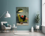 woman reading in a green armchair glass wall art styled above an armchair in a reading corner