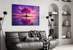 violet blossom tree at twilight glass wall art styled above an armchair in a reading corner