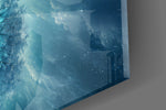 Close-up detail of the frost-white canopy glowing with turquoise light over an icy mirror lake on the glass surface