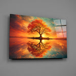 autumn tree at sunset on a mirror lake glass wall art angled to show the polished tempered glass panel