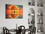 autumn tree at sunset on a mirror lake glass wall art leaning beside a dark leather sofa