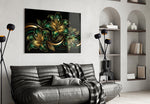 emerald and gold lilies on black glass wall art styled above an armchair in a reading corner