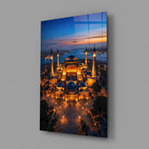 twilight aerial view of an illuminated mosque glass wall art angled to show the polished tempered glass panel