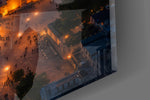 Close-up detail of the floodlit domes and the dusk-lit strait beyond on the glass surface