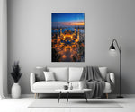 twilight aerial view of an illuminated mosque panel bringing character to a minimalist living room wall