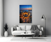 twilight aerial view of an illuminated mosque panel bringing character to a minimalist living room wall