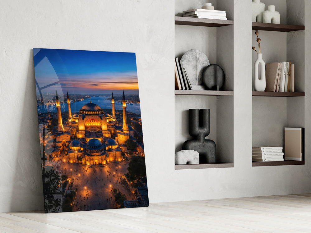 twilight aerial view of an illuminated mosque panel resting in a shelving niche in a modern interior