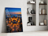 twilight aerial view of an illuminated mosque panel resting in a shelving niche in a modern interior