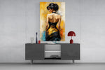 Woman in black and gold gown glass wall art styled in an atmospheric room setting