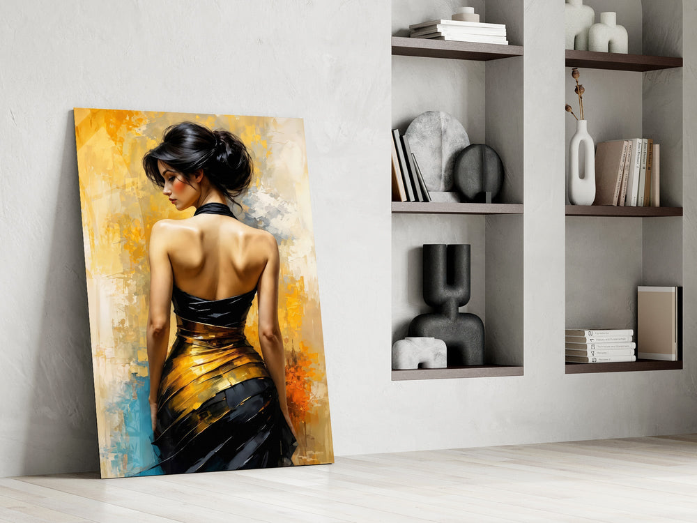 Black and gold figure glass panel resting in a styled niche in a modern interior