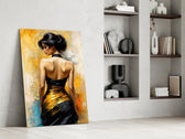 Black and gold figure glass panel resting in a styled niche in a modern interior