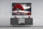 Red maple tree by a misty lake glass wall art displayed above a console in a modern grey living room