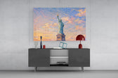Statue of Liberty glass wall art displayed above a console in a modern interior