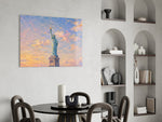 Statue of Liberty glass wall art shown in a warm, styled interior setting