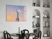 Statue of Liberty glass wall art shown in a warm, styled interior setting