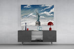 Statue of Liberty glass wall art displayed above a console in a modern interior