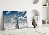 Statue of Liberty glass wall art leaning against a wall in a minimalist interior