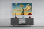 Statue of Liberty glass wall art displayed above a console in a modern interior