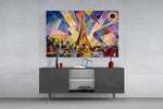 Eiffel Tower glass wall art displayed above a console in a modern interior