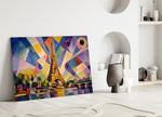 Eiffel Tower glass wall art leaning against a wall in a minimalist interior