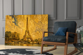 Eiffel Tower glass wall art hanging as a focal point in a modern room