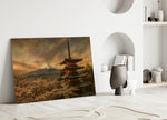 Mount Fuji Pagoda glass wall art leaning against a wall in a minimalist interior