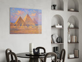 Pyramids of Giza glass wall art shown in a warm, styled interior setting