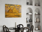Pyramids of Giza glass wall art shown in a warm, styled interior setting