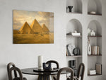 Pyramids of Giza glass wall art shown in a warm, styled interior setting