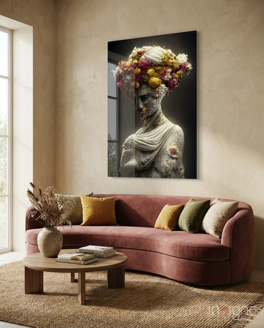 Abandoned Statue glass wall art displayed above a rose-velvet sofa in a warm living room with travertine console and woven floor rug