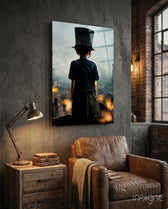 Burning the Past glass wall art displayed above a tan leather armchair in a moody study with brass desk lamp and reclaimed-wood console