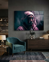 Tupac glass wall art displayed above a sideboard in a man cave